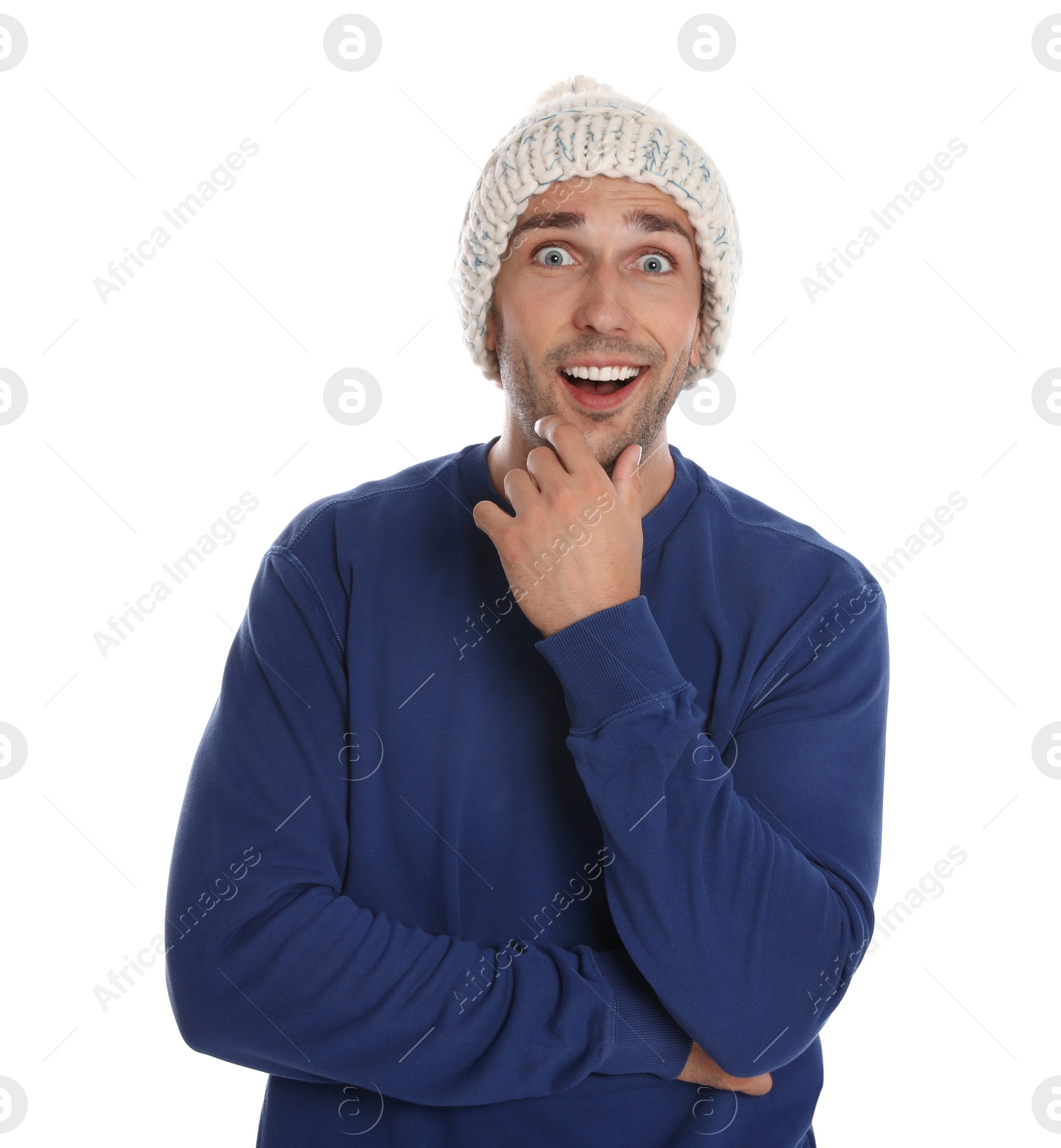 Photo of Happy young man in hat and blue sweatshirt on white background. Winter season