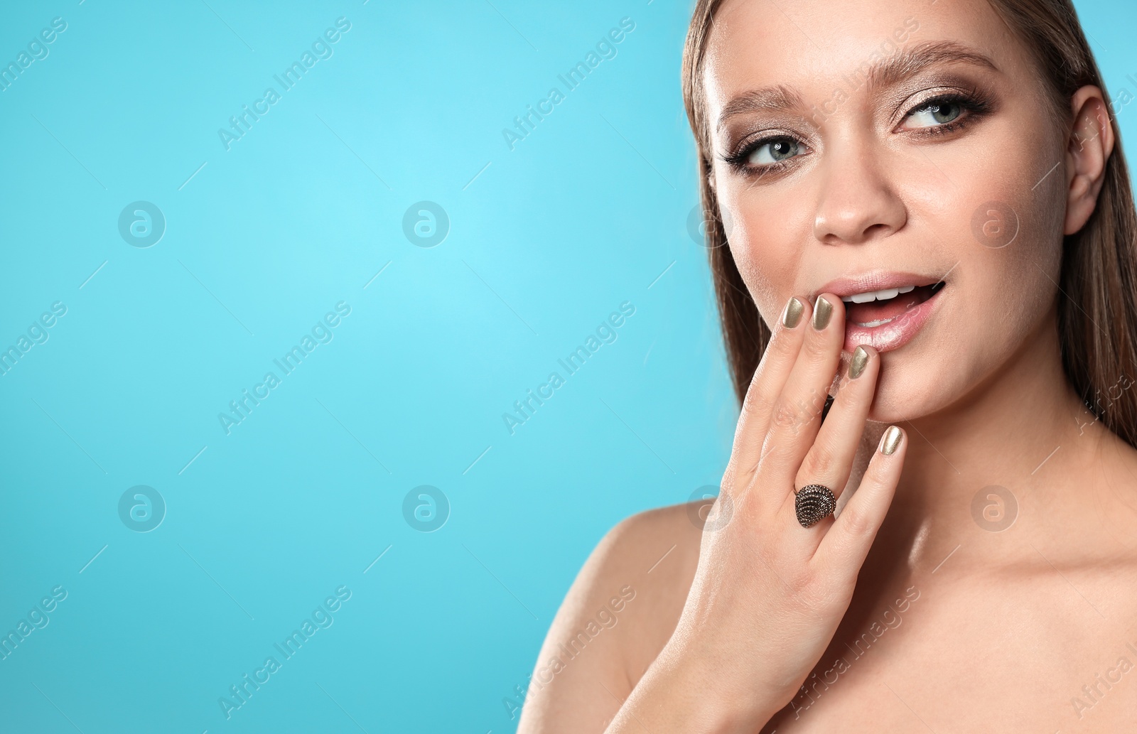 Photo of Beautiful woman with stylish nail polish on color background, space for text