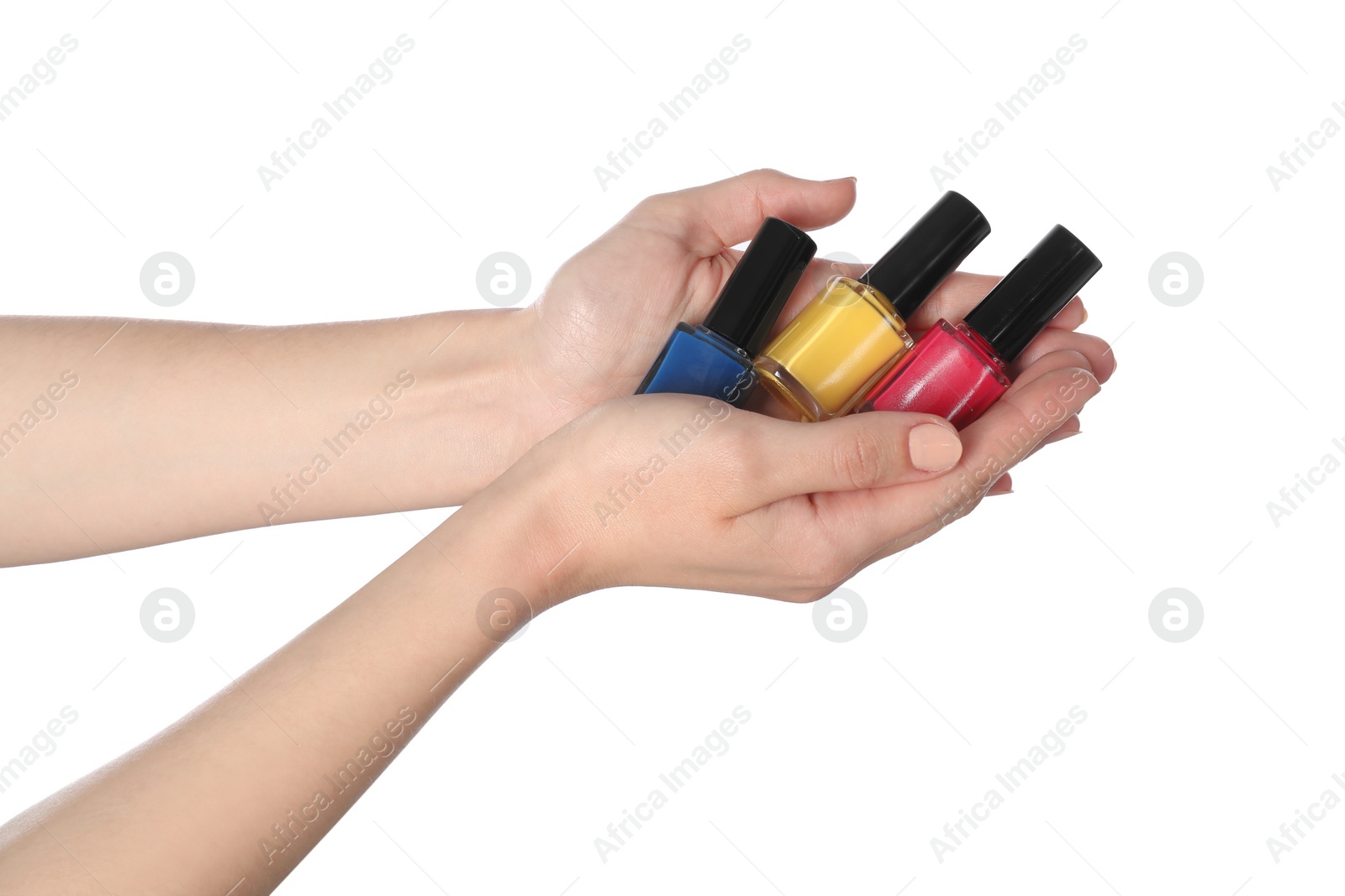 Photo of Woman holding nail polishes on white background, closeup