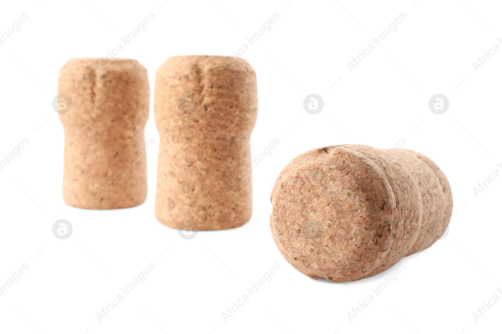 Photo of Many sparkling wine corks on white background