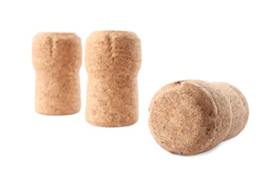 Many sparkling wine corks on white background