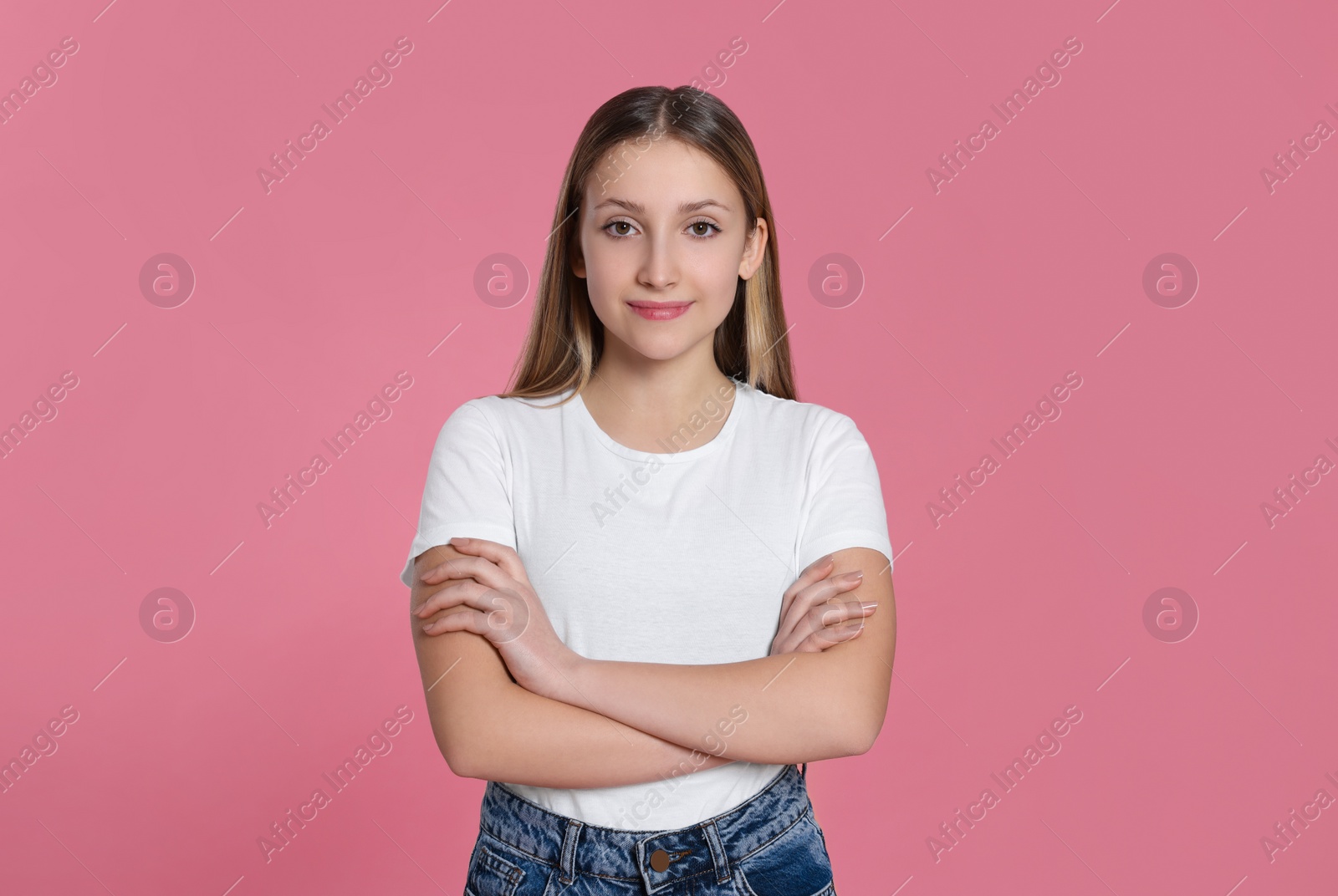 Photo of Portrait of beautiful teenage girl on pink background