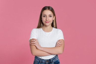 Photo of Portrait of beautiful teenage girl on pink background