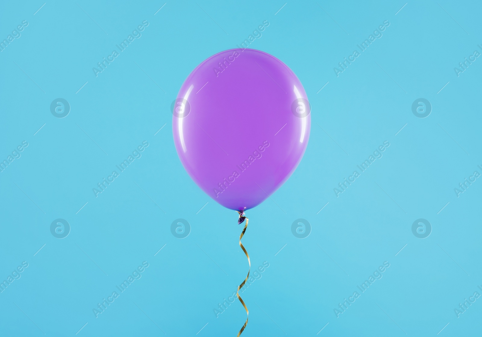 Photo of Bright balloon on color background. Celebration time