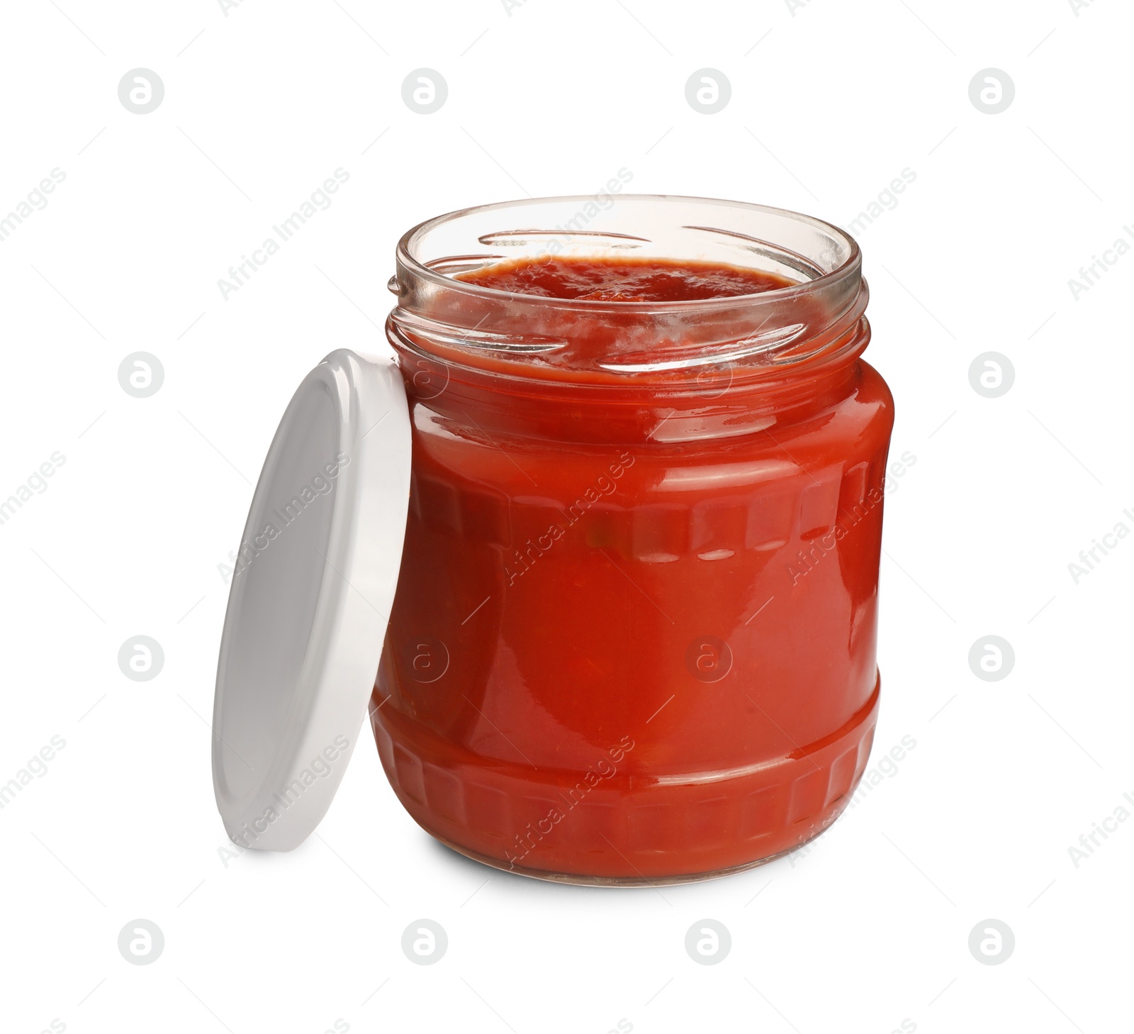 Photo of Glass jar of delicious canned lecho and lid on white background