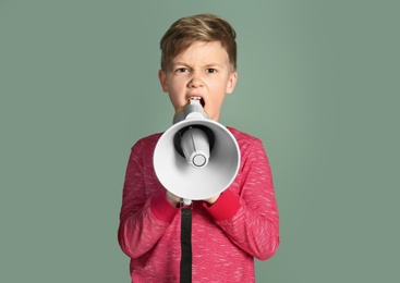 Photo of Cute little boy with megaphone on color background