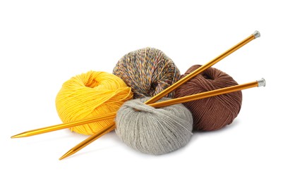 Photo of Different balls of woolen knitting yarns and needles on white background