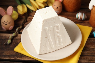 Traditional cottage cheese Easter paskha on wooden table