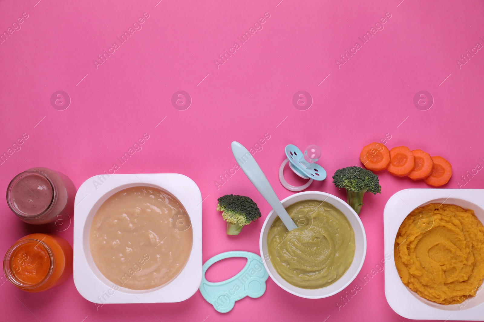 Photo of Flat lay composition with healthy baby food on pink background. Space for text