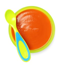 Photo of Delicious baby food in bowl and spoon isolated on white, top view