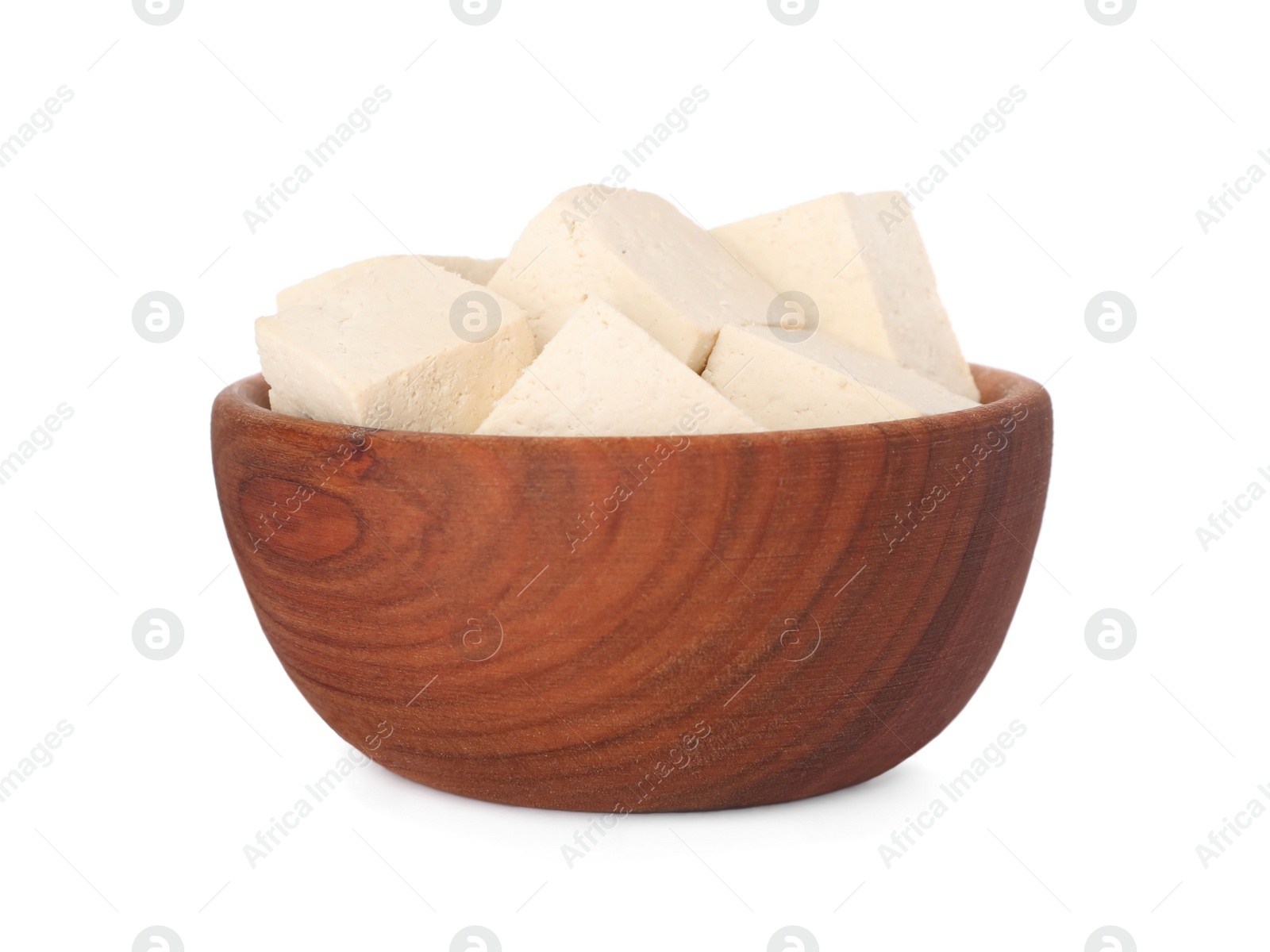 Photo of Wooden bowl with delicious tofu isolated on white