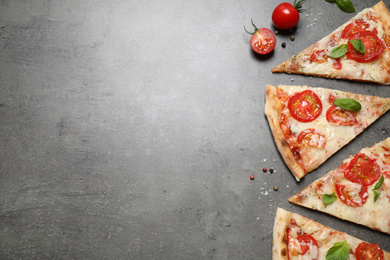 Slices of delicious pizza Margherita on grey table, flat lay. Space for text