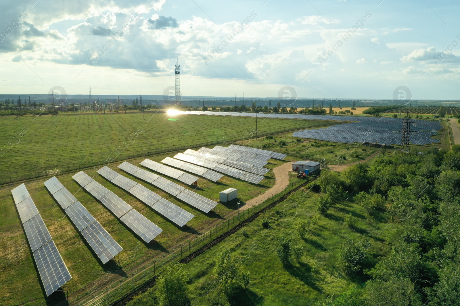 Photo of Solar panels installed outdoors, aerial view. Alternative energy source