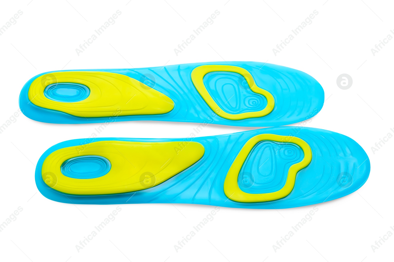 Photo of Light blue orthopedic insoles isolated on white