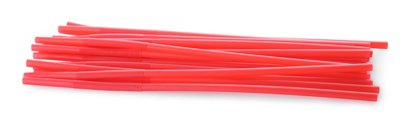 Photo of Red plastic cocktail straws on white background