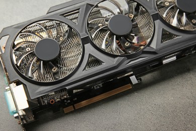 One computer graphics card on grey textured table, closeup