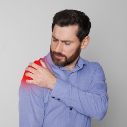 Image of Man suffering from rheumatism on light background