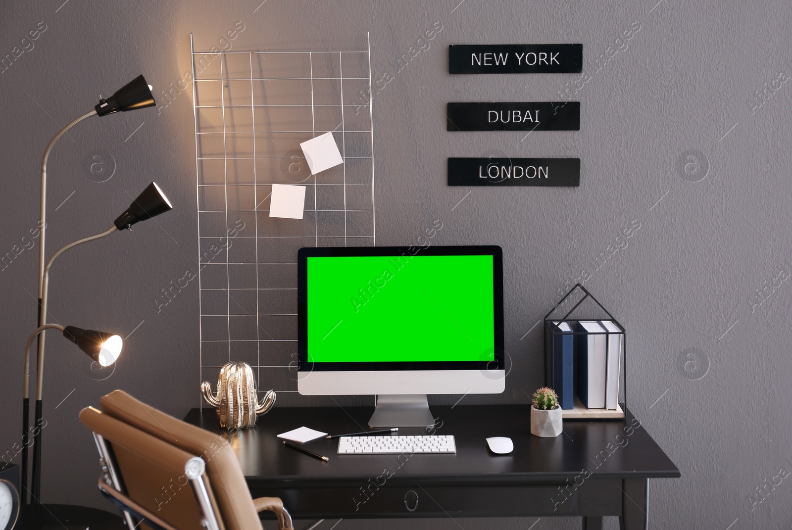 Image of Computer display with chroma key on desk in room. Comfortable workplace