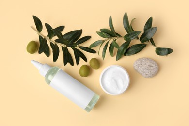 Different cosmetic products, stone and ingredient on beige background, flat lay