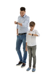 Photo of Portrait of dad and his son checking time isolated on white