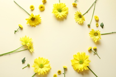 Photo of Beautiful chamomile flowers on color background, flat lay with space for text