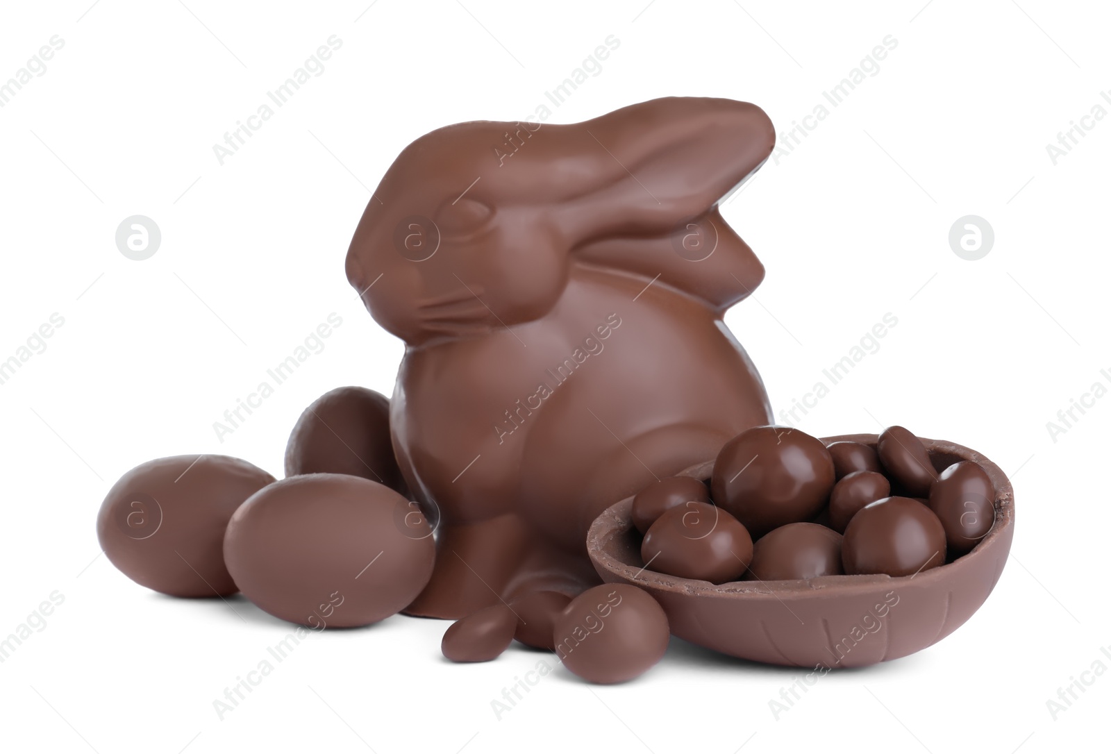 Photo of Chocolate Easter bunny and eggs on white background