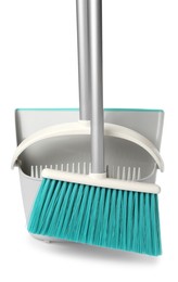 Plastic broom and dustpan on white background