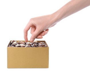 Photo of Woman taking chocolate candy out from box isolated on white, closeup