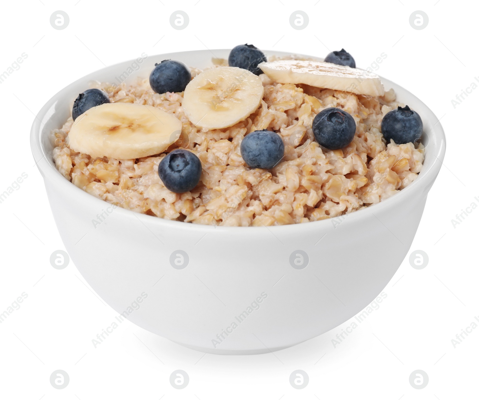 Photo of Tasty boiled oatmeal with blueberries and banana in bowl isolated on white