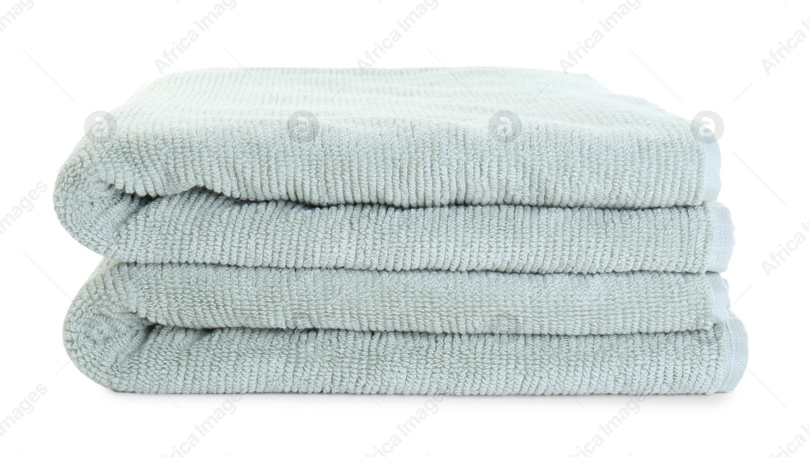 Photo of Soft folded terry towels isolated on white