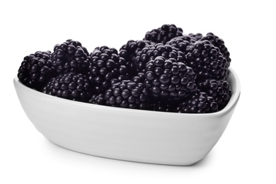 Photo of Bowl of tasty ripe blackberries on white background