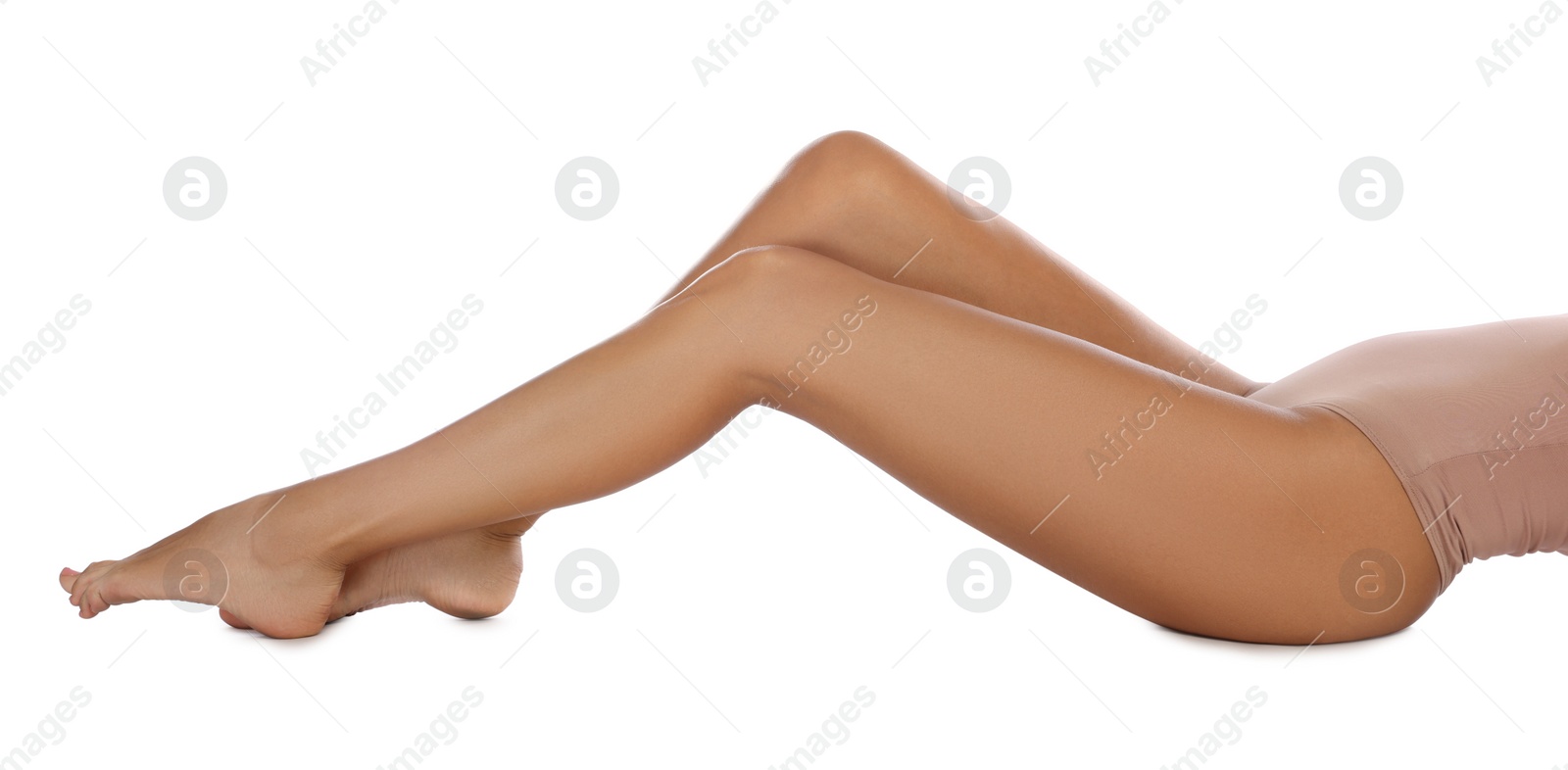 Photo of Woman with beautiful long legs on white background, closeup