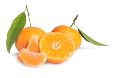 Photo of Fresh ripe juicy tangerines with green leaves isolated on white