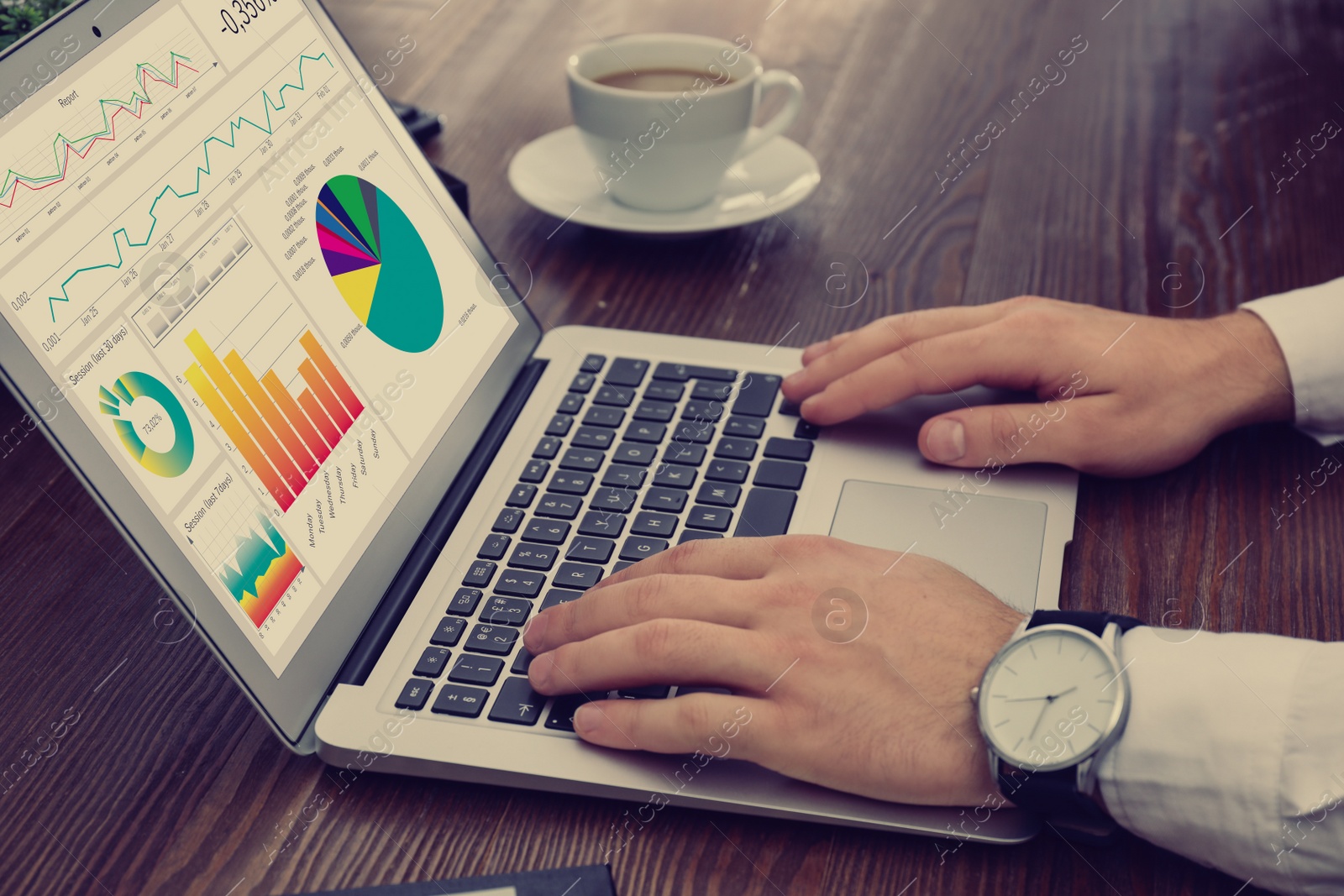 Image of Man working with laptop at table, closeup. Business analytics