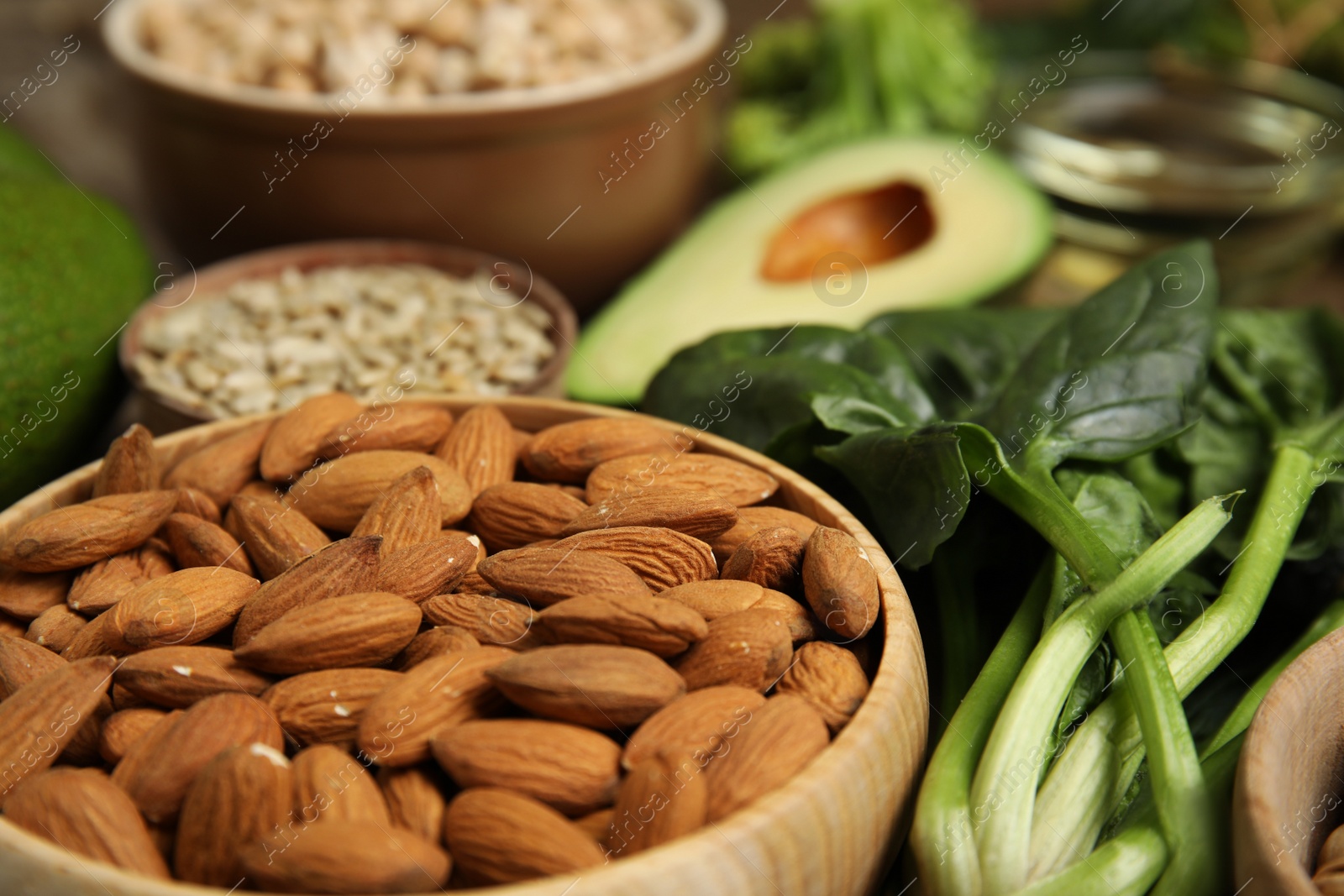 Photo of Different products rich in vitamin E on table, closeup