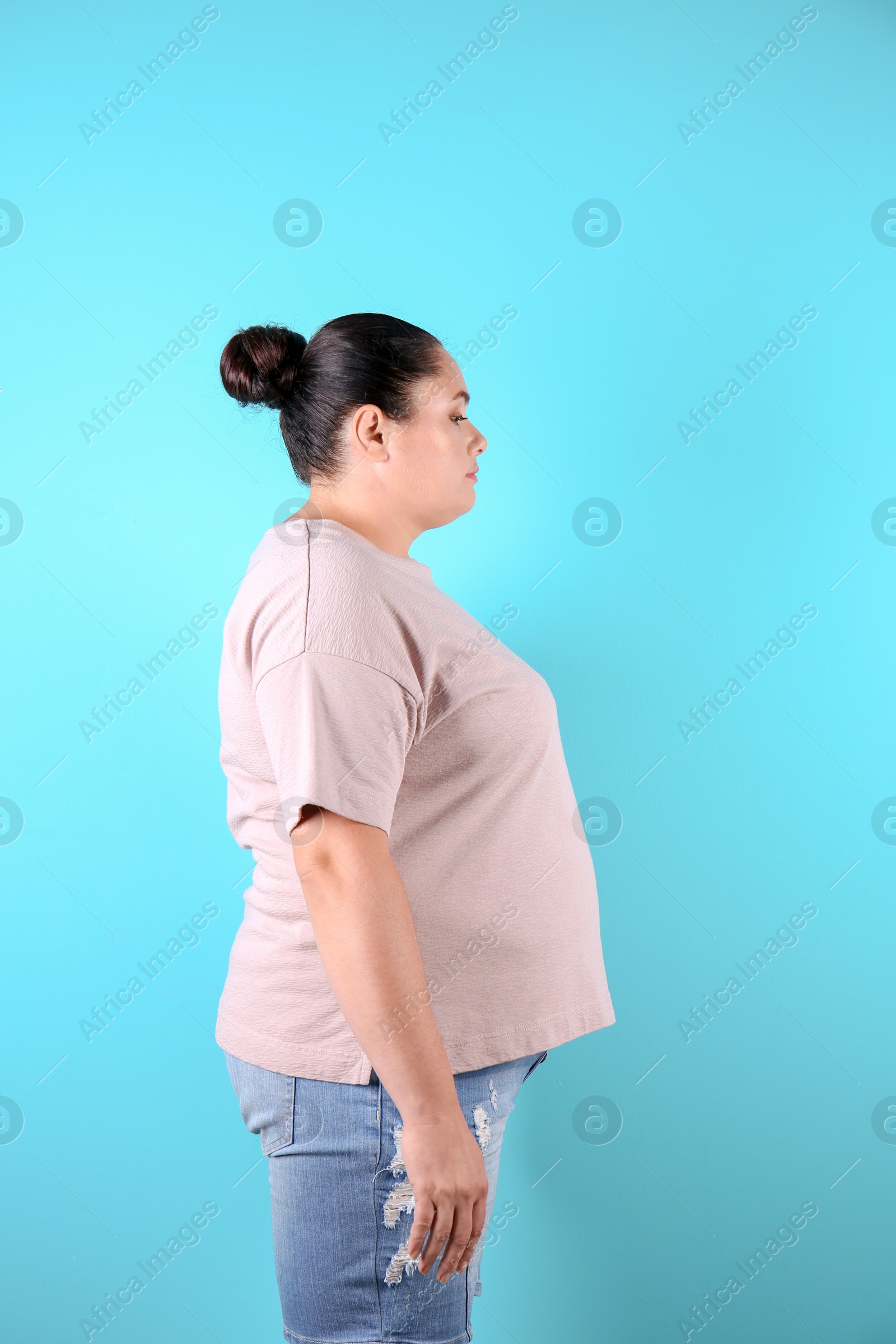 Photo of Fat woman on color background. Weight loss