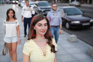 Image of Facial recognition system identifying people on city street. Woman and her personal data