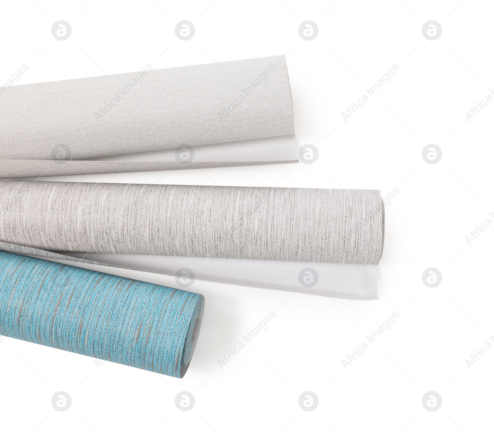 Photo of Different wallpaper rolls isolated on white, top view