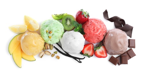 Scoops of different ice creams and ingredients on white background, top view