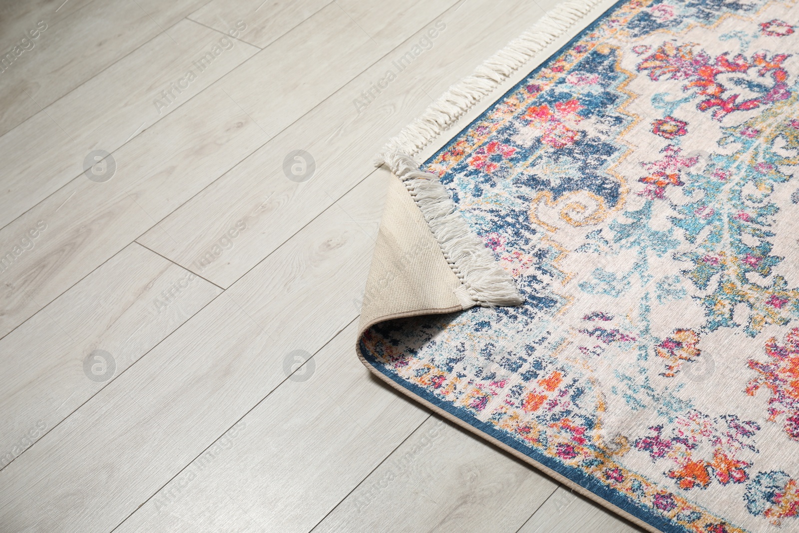 Photo of Soft carpet with pattern on white laminated floor indoors, space for text