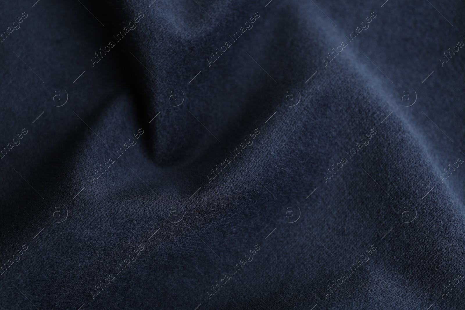 Photo of Texture of dark blue fabric as background, closeup