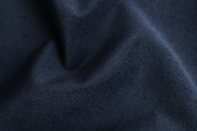 Photo of Texture of dark blue fabric as background, closeup