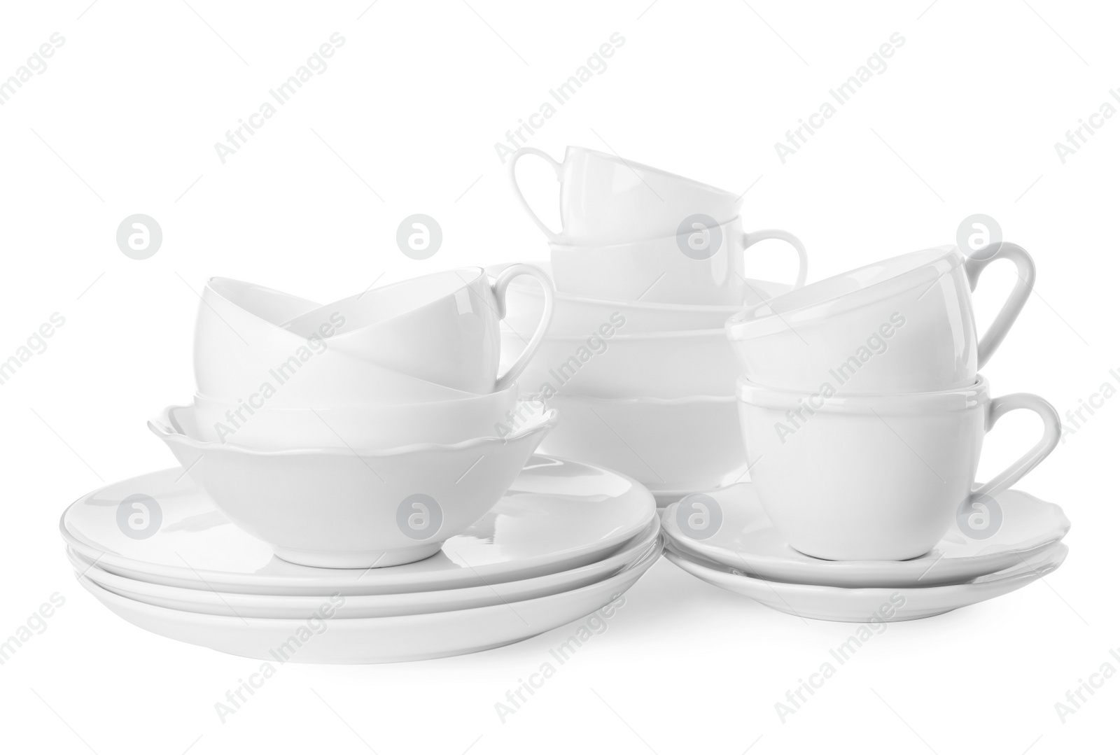 Photo of Set of clean tableware isolated on white