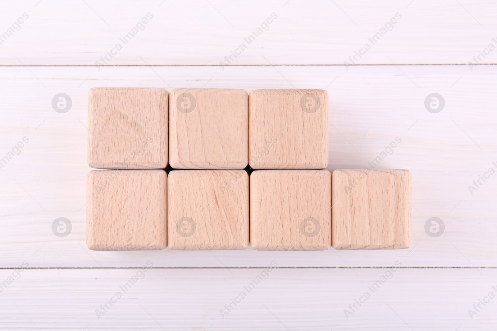 Photo of International Organization for Standardization. Cubes with abbreviation ISO and number 9001 on white wooden table, flat lay