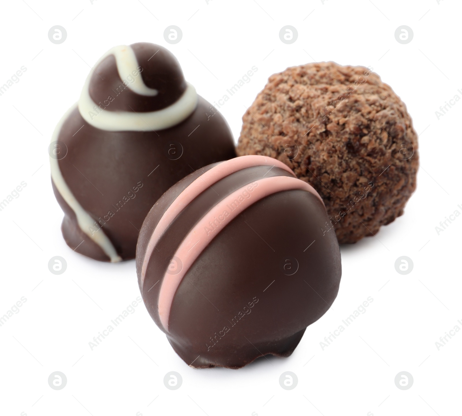 Photo of Many different delicious chocolate truffles on white background