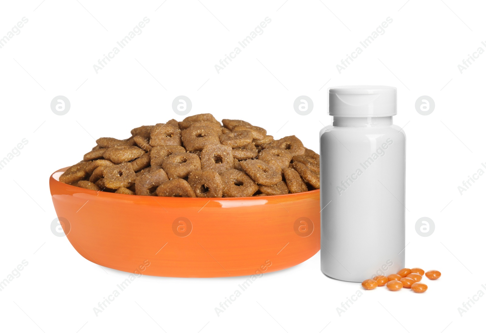 Image of Dry pet food in feeding bowl and bottle with vitamin pills on white background