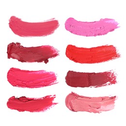 Image of Smears of different beautiful lipsticks on white background, top view