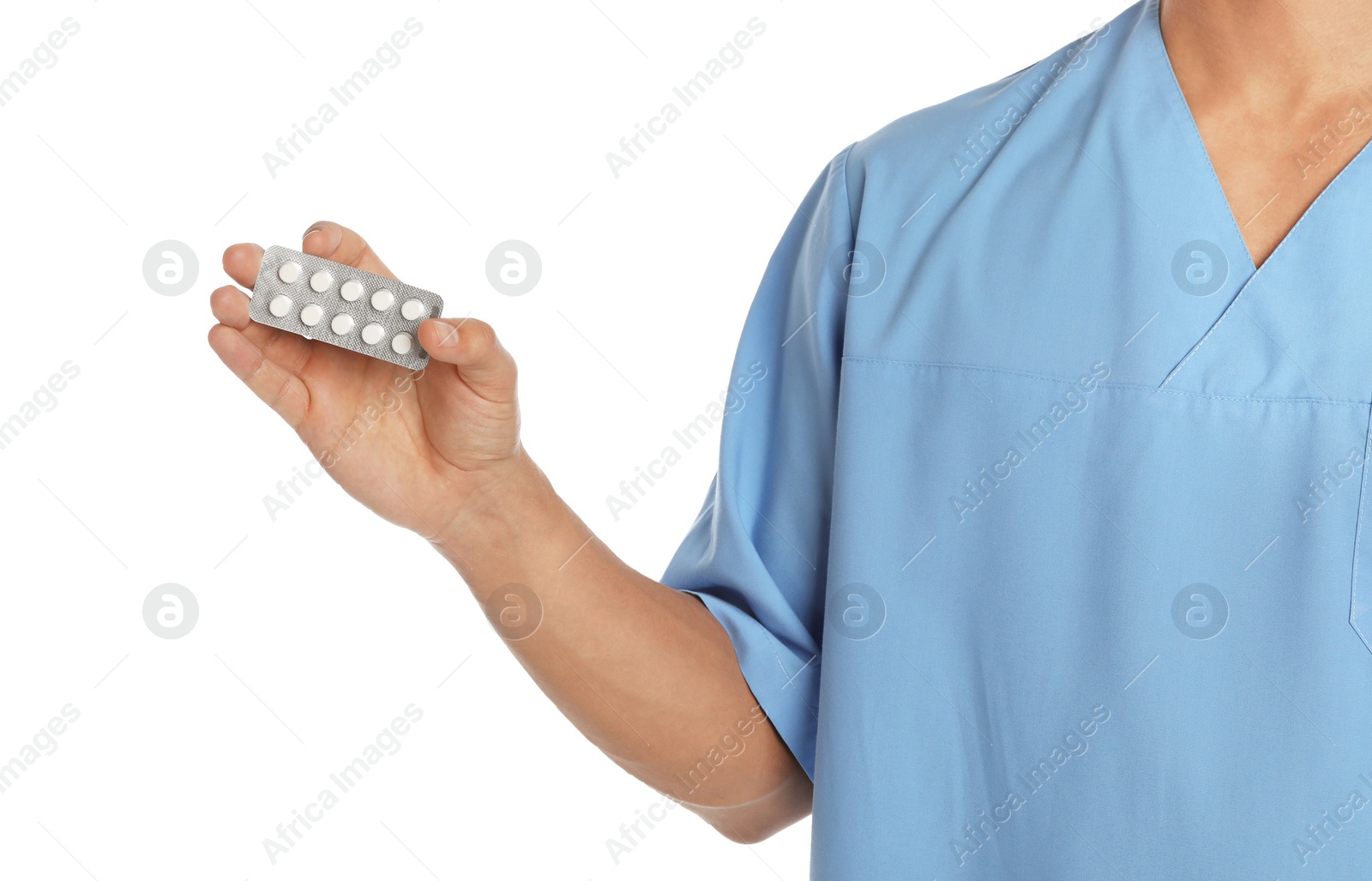 Photo of Male doctor holding pills on white background, closeup. Medical object