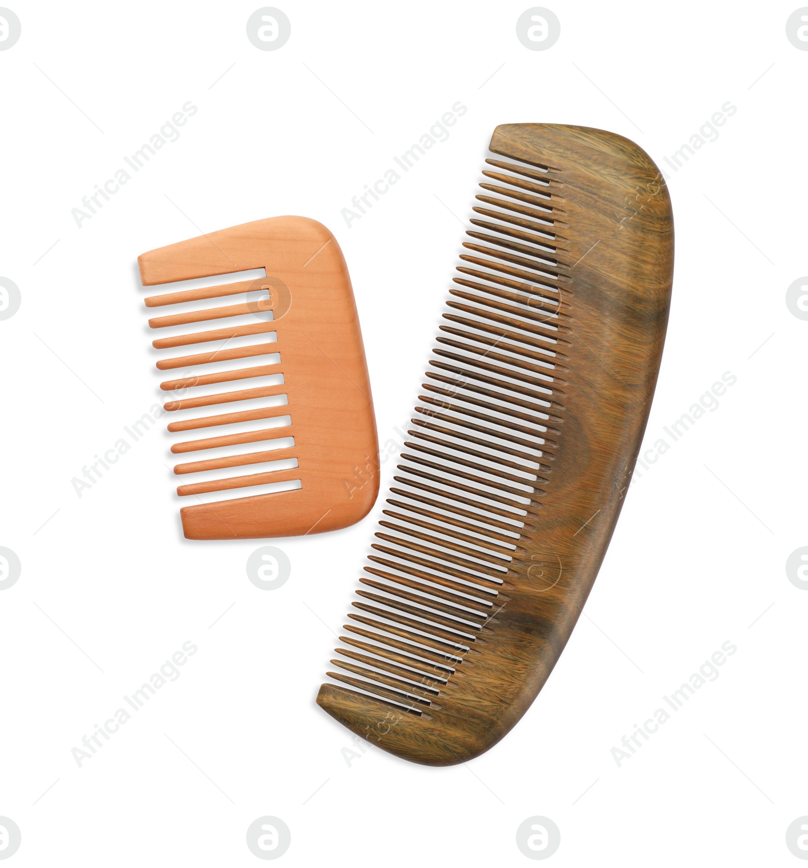 Photo of New wooden hair combs isolated on white, top view