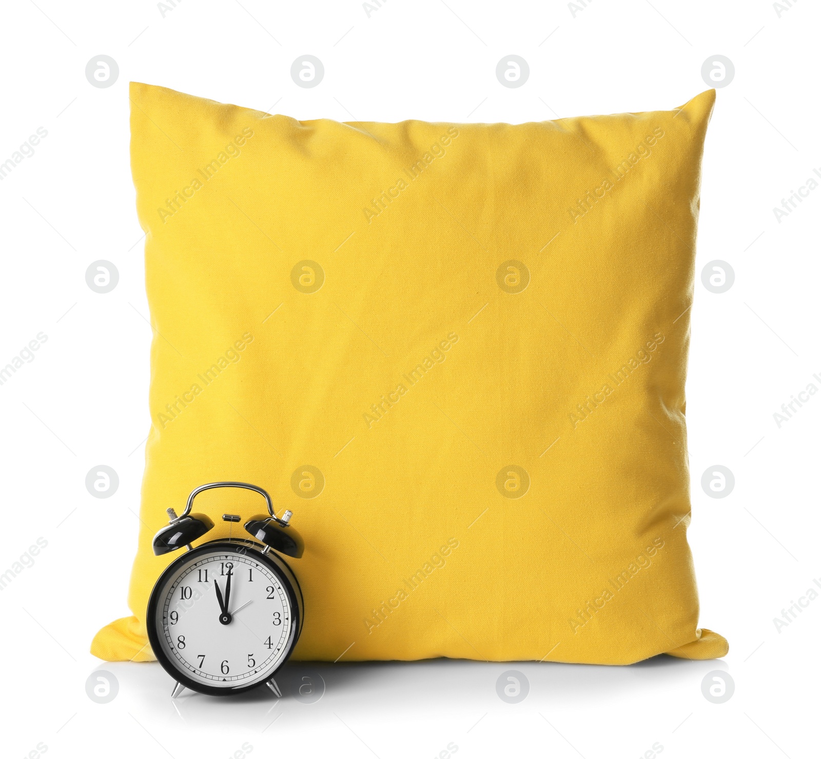 Photo of Soft decorative pillow and alarm clock on white background